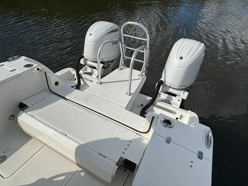 Slide: The Image of 2025 World Cat 260 CC-X boat with dual outboard engines on water. - 14