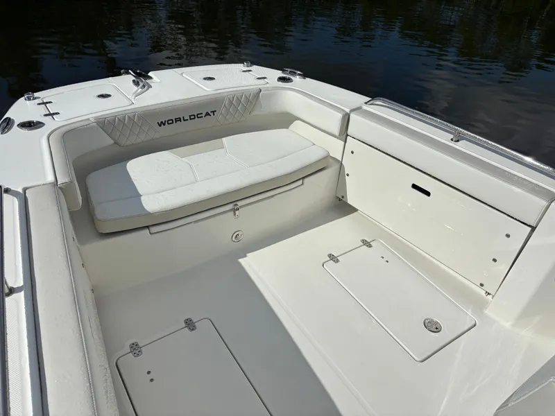 Slide: The Image of 2025 World Cat 260 CC-X boat interior with white seating and storage compartments. - 22