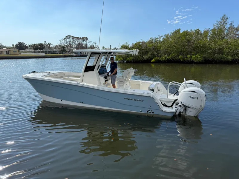 Slide: The Image of 2025 World Cat 260 CC-X boat on calm water with Yamaha engines. - 4