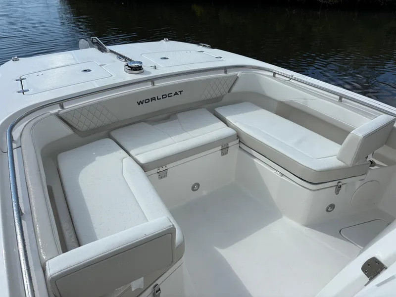 Slide: The Image of 2025 World Cat 260 CC-X boat interior with white seating and storage compartments. - 7