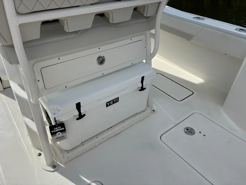 Slide: The Image of 2025 World Cat 260 CC-X boat interior with Yeti cooler storage. - 9