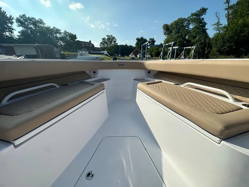 Slide: The Image of 2024 Jupiter 43 boat interior with cushioned seating and sleek design. - 20