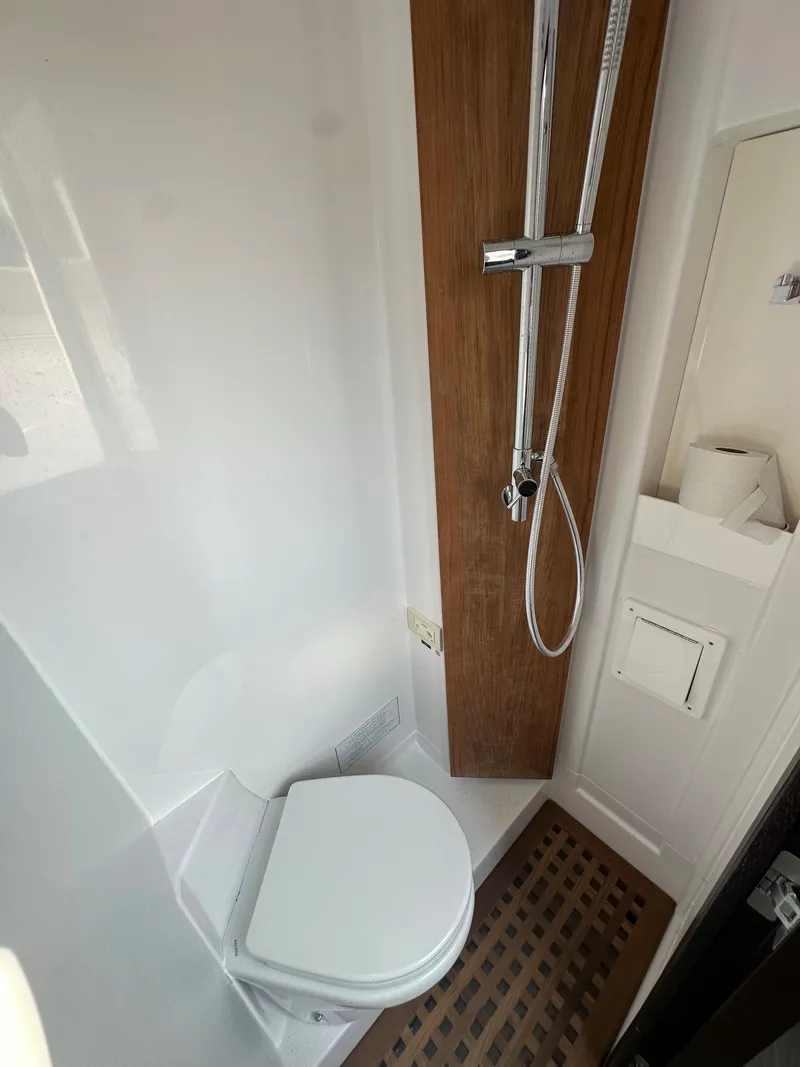 Slide: The Image of Modern bathroom in 2024 Jupiter 43 RV with shower and toilet. - 29