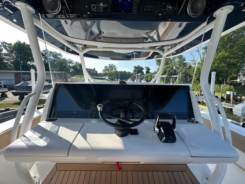 Slide: The Image of 2024 Jupiter 43 boat helm with modern controls and dual screens. - 42