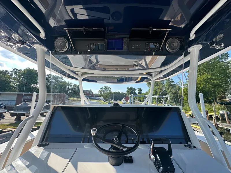 Slide: The Image of 2024 Jupiter 43 boat helm with advanced navigation controls and sleek design. - 44