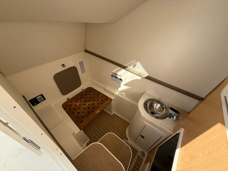 Slide: The Image of 2025 World Cat 325 DC cabin interior with seating and sink. - 19