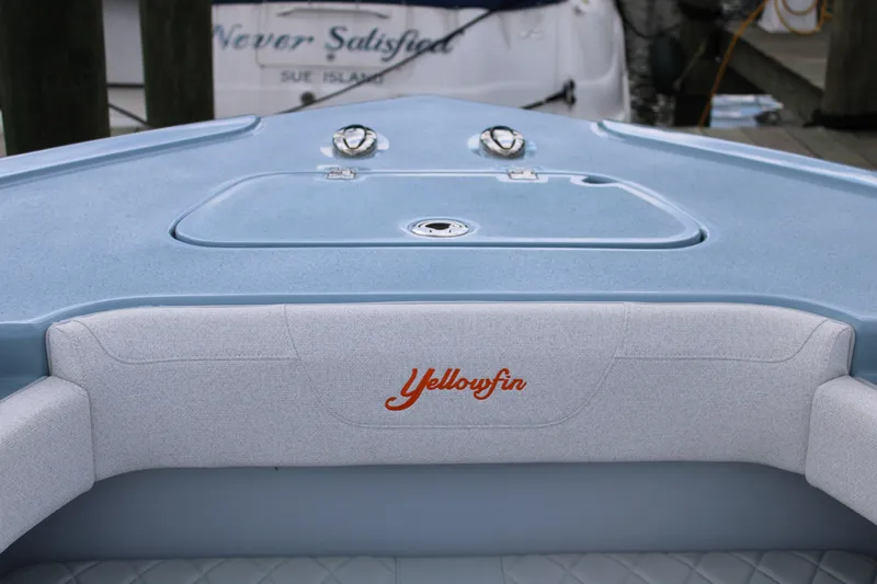 Slide: The Image of 2024 Yellowfin 36 Offshore boat interior with logo and seating. - 17