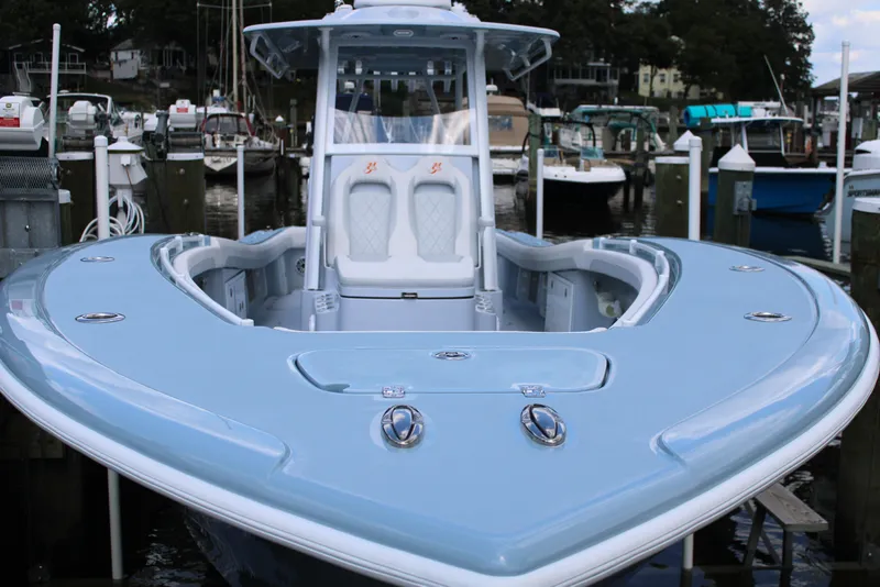 Slide: The Image of 2024 Yellowfin 36 Offshore boat docked, showcasing sleek design and spacious deck. - 3