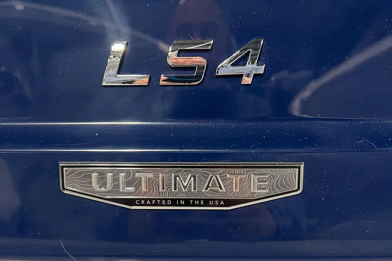 Slide: The Image of 2025 Regal LS4 Ultimate badge, blue finish, "Crafted in the USA" inscription. - 21