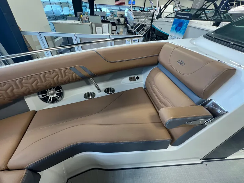 Slide: The Image of 2025 Regal LS4 boat interior with brown leather seating and modern design. - 10
