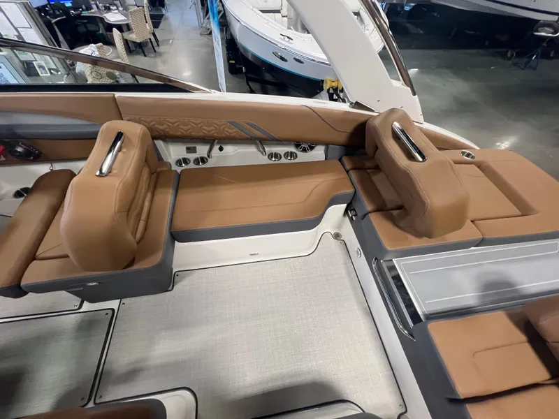 Slide: The Image of 2025 Regal LS4 boat interior with tan leather seating and modern design. - 15