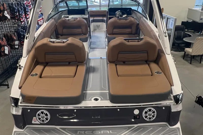 Slide: The Image of 2025 Regal LS4 boat interior with tan seating and modern design. - 19