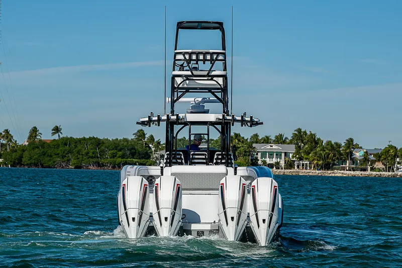 Slide: The Image of 2024 Costa Custom Boats 34 with four engines on the water. - 44