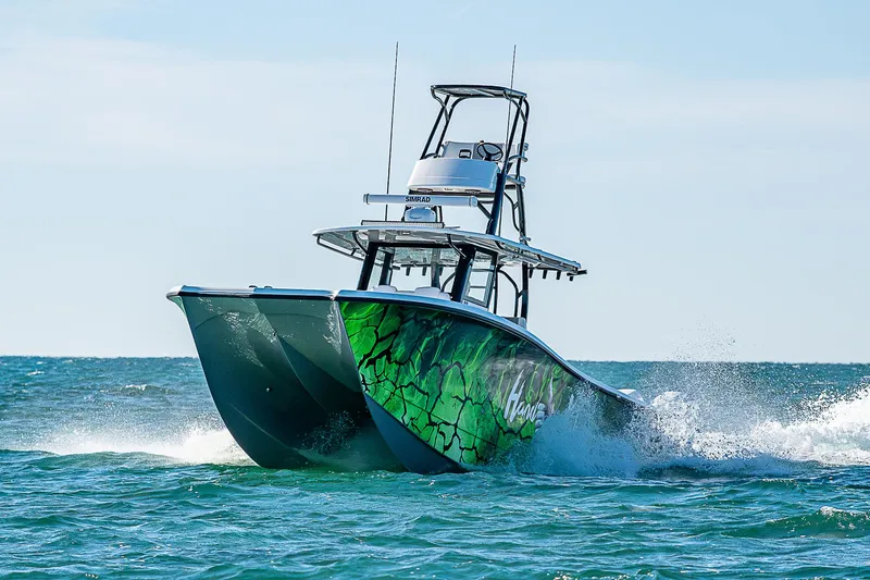 Slide: The Image of Costa Custom Boats 34, 2024, seating area on open water. - 2