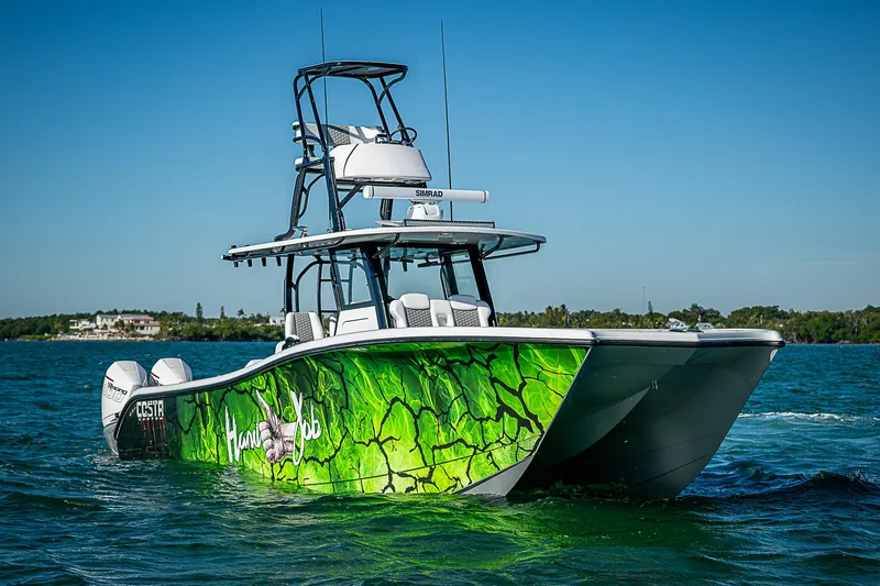 Slide: The Image of 2024 Costa Custom Boats 34 on open water with luxurious seating. - 33
