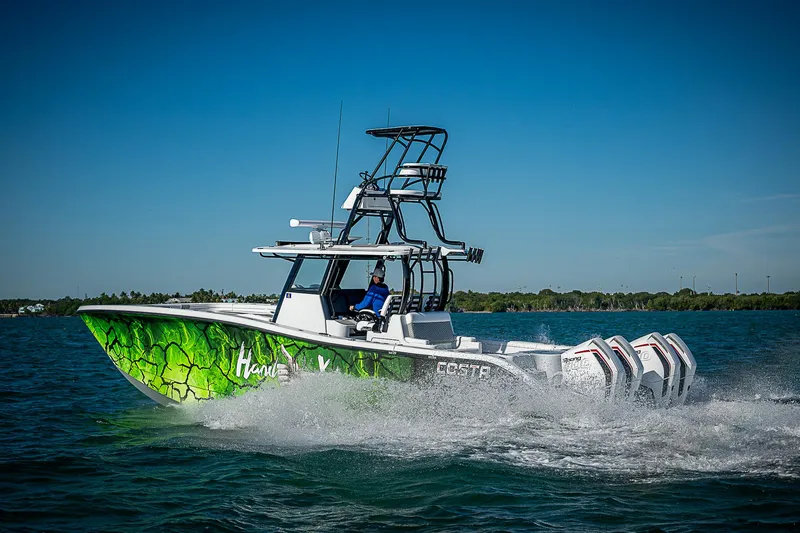 Slide: The Image of Helm of Costa Custom Boats 34, 2024 model, on open sea. - 4