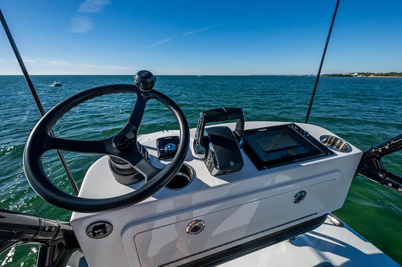 Slide: The Image of 2024 Costa Custom Boats 34 cruising on water with triple outboard engines. - 64
