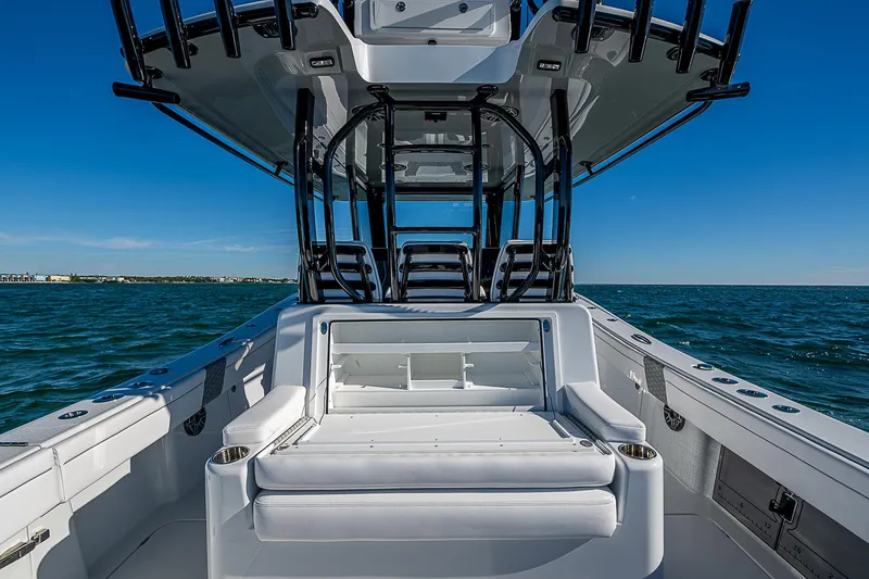 Slide: The Image of 2024 Costa Custom Boats 34 cruising under a bridge on a sunny day. - 67