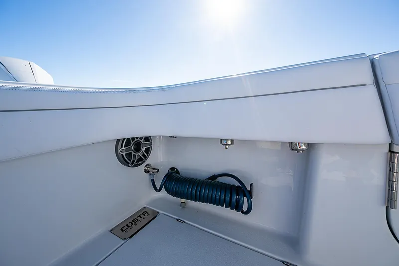 Slide: The Image of 2024 Costa Custom Boats 34 cruising on water near waterfront buildings. - 72