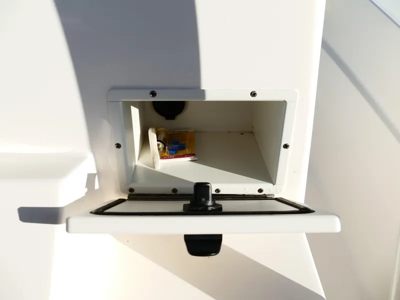 Slide: The Image of 2019 Sea Born LX22 Center Console storage compartment with open hatch. - 17