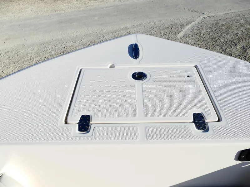 Slide: The Image of 2019 Sea Born LX22 Center Console boat deck with storage hatch. - 22