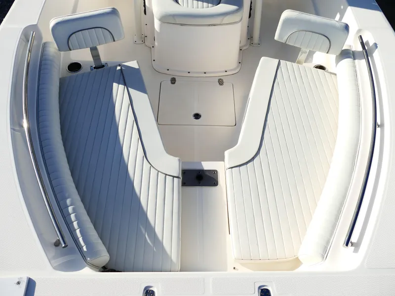 Slide: The Image of 2019 Sea Born LX22 Center Console boat interior with cushioned seating. - 24