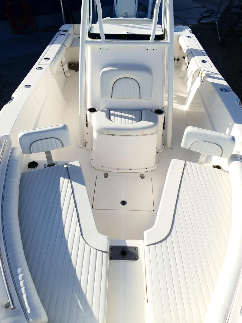 Slide: The Image of 2019 Sea Born LX22 Center Console boat interior with seating and storage. - 25