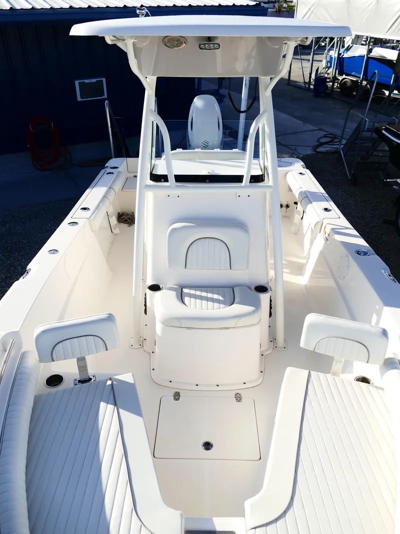 Slide: The Image of 2019 Sea Born LX22 Center Console boat with spacious deck and seating. - 26