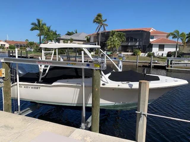 Slide: The Image of 2018 Key West 239 DFS boat docked near waterfront homes. - 1