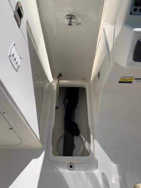 Slide: The Image of 2018 Key West 239 DFS boat storage compartment, open and empty. - 11