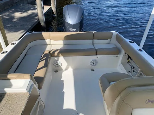Slide: The Image of 2018 Key West 239 DFS boat interior with seating and outboard motor. - 22