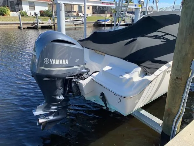 Slide: The Image of 2018 Key West 239 DFS boat with Yamaha outboard motor docked in marina. - 5
