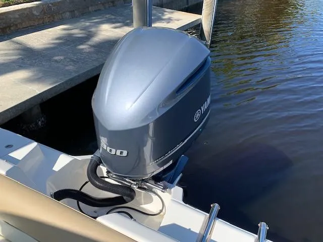 Slide: The Image of 2018 Key West 239 DFS with Yamaha 300 outboard motor by a dock. - 7