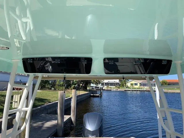 Slide: The Image of 2018 Key West 239 DFS boat with outboard motor on a calm waterfront. - 9