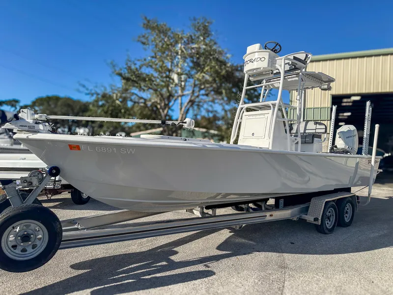 Slide: The Image of 2021 Dorado 25 FD boat on trailer, parked outdoors. - 1