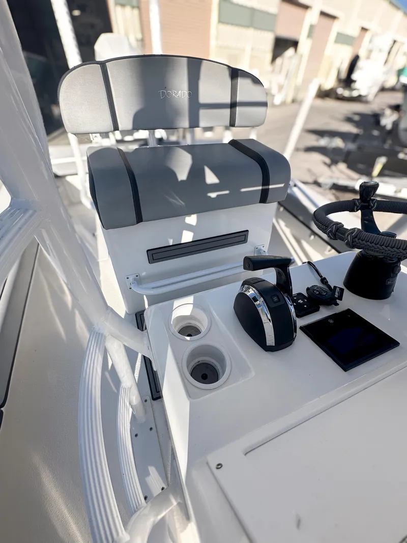 Slide: The Image of 2021 Dorado 25 FD boat helm with controls and seating. - 14