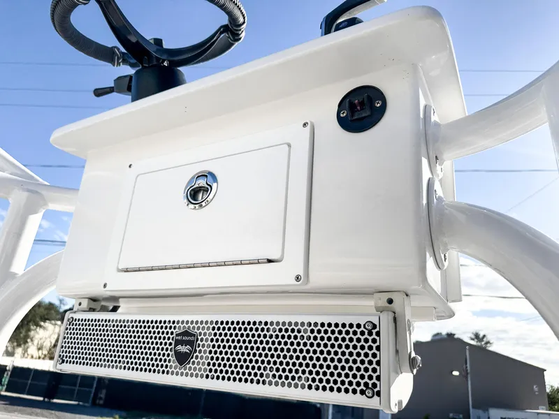 Slide: The Image of 2021 Dorado 25 FD boat console with storage and speaker. - 17