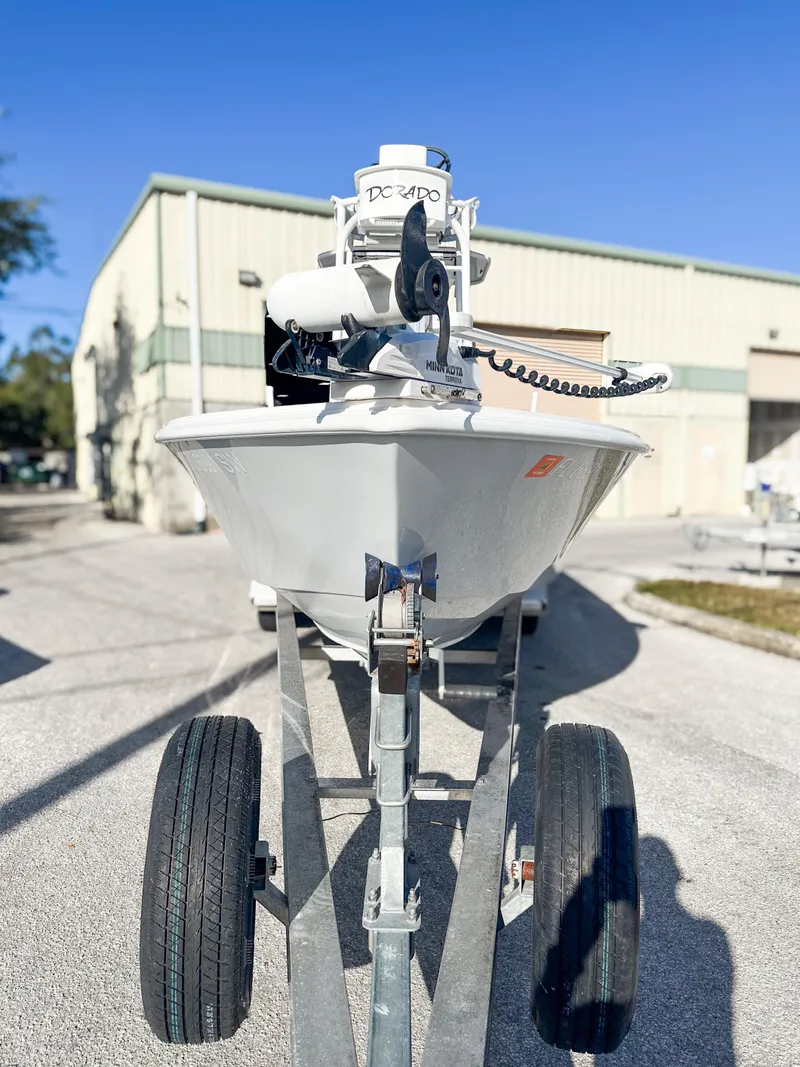 Slide: The Image of 2021 Dorado 25 FD boat on trailer in industrial area. - 2