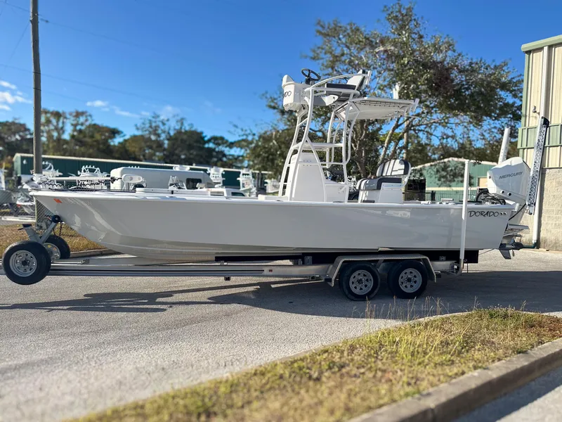 Slide: The Image of 2021 Dorado 25 FD boat on trailer, parked outdoors. - 4