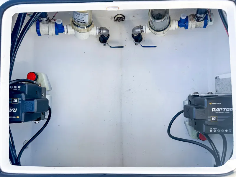 Slide: The Image of 2021 Dorado 25 FD boat compartment with pumps and valves. - 7