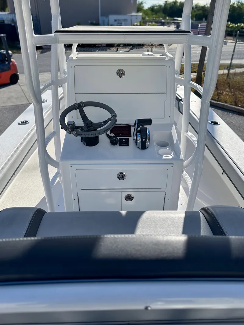 Slide: The Image of 2021 Dorado 25 FD boat console with steering wheel and controls. - 8