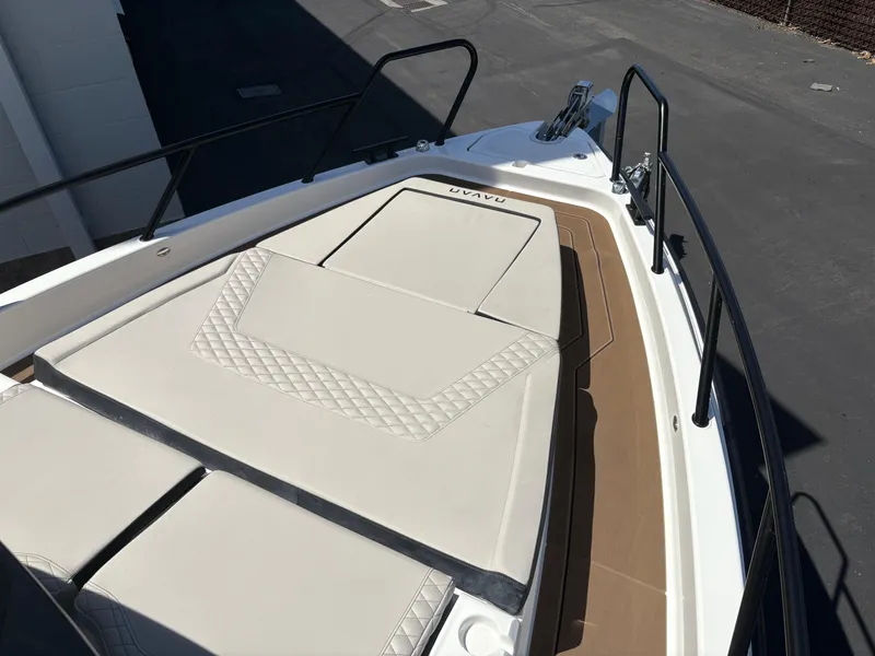 Slide: The Image of 2025 Navan C30 boat deck with cushioned seating and sleek design. - 12