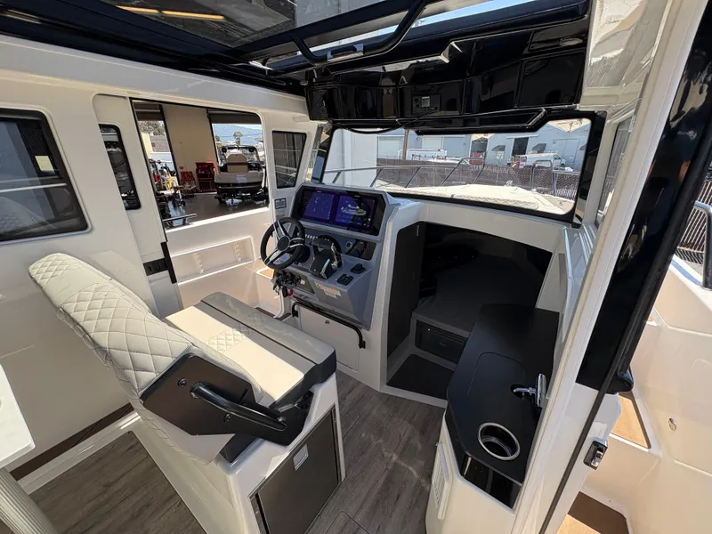 Slide: The Image of Interior of 2025 Navan C30 boat with modern helm and seating. - 15