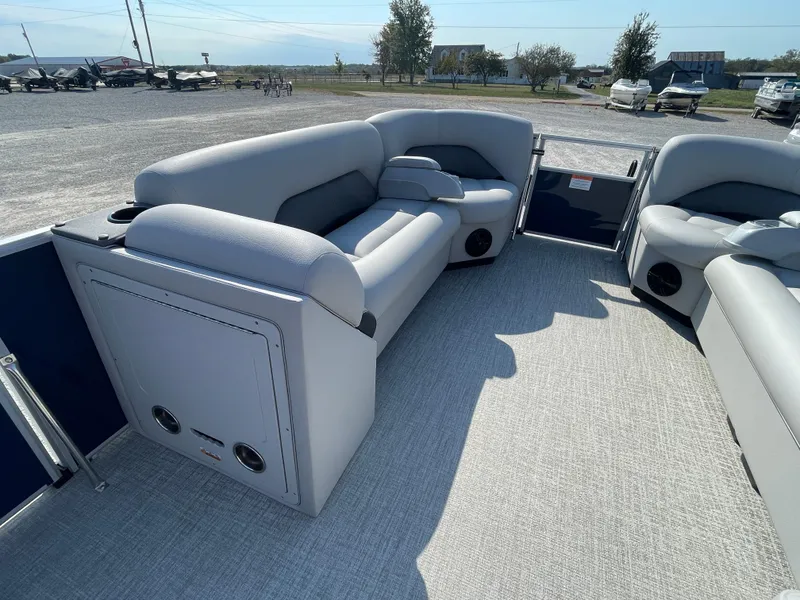 Slide: The Image of 2025 Landau Island Breeze 25 pontoon boat interior with plush seating and spacious layout. - 12