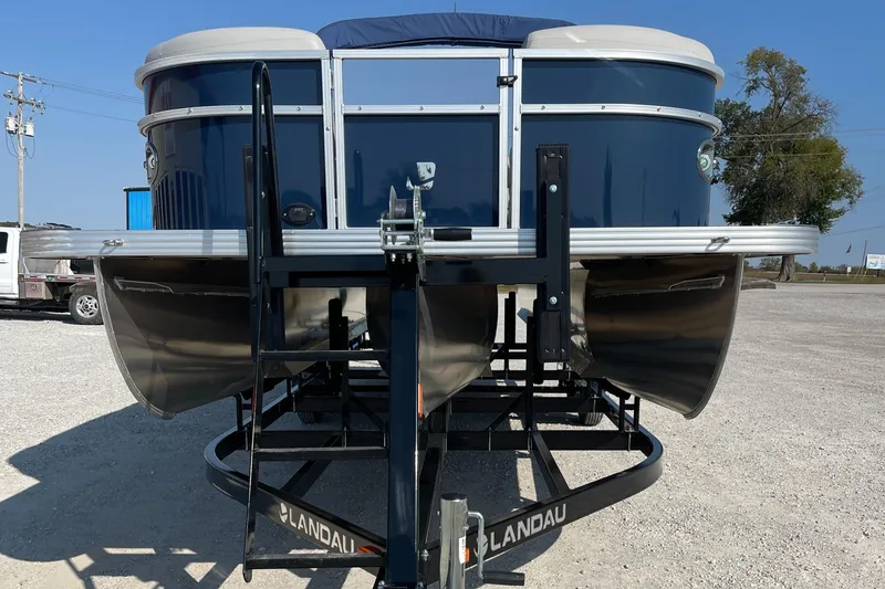 Slide: The Image of 2025 Landau Island Breeze 25 pontoon boat with 225HP Suzuki engine on trailer. - 3