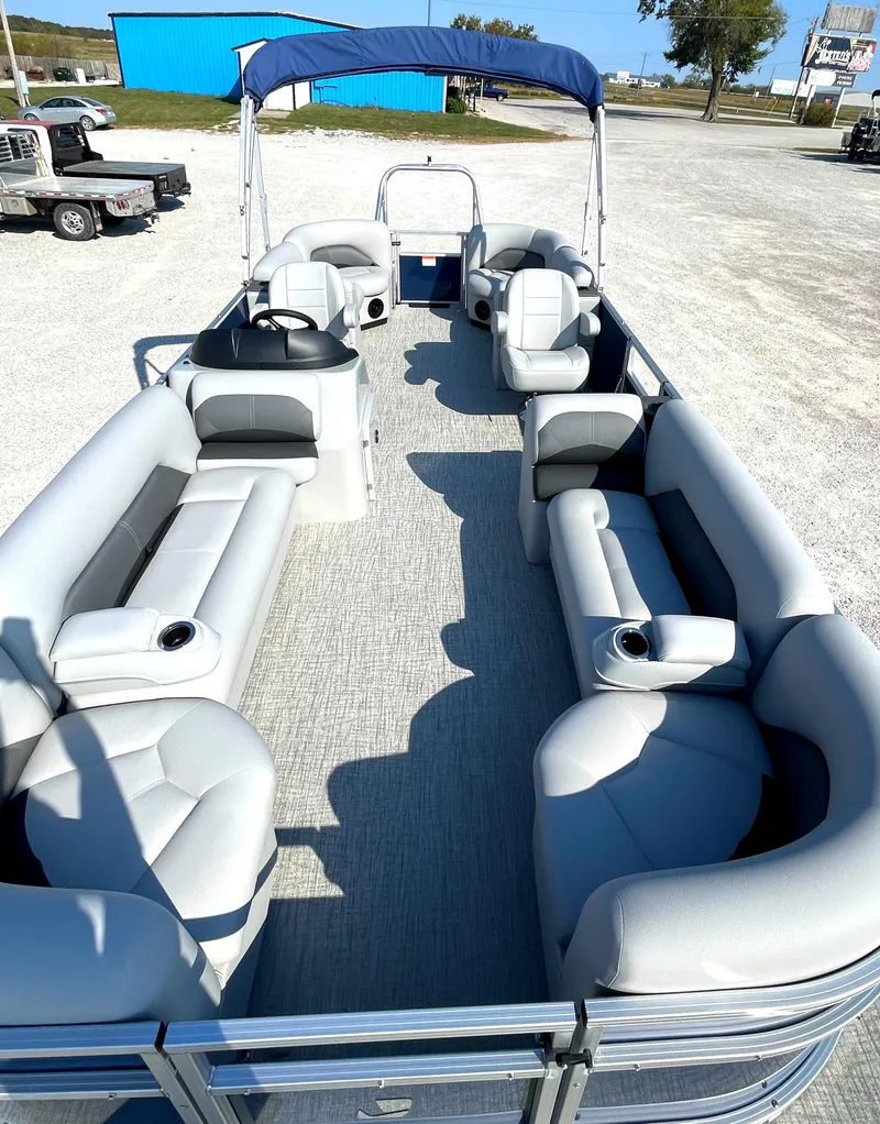 Slide: The Image of 2025 Landau Island Breeze 25 pontoon boat with spacious seating and 225HP Suzuki engine. - 5