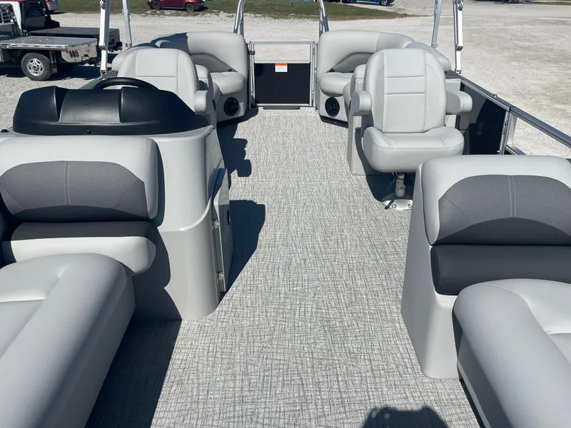 Slide: The Image of 2025 Landau Island Breeze 25 pontoon boat interior with plush seating and modern design. - 12