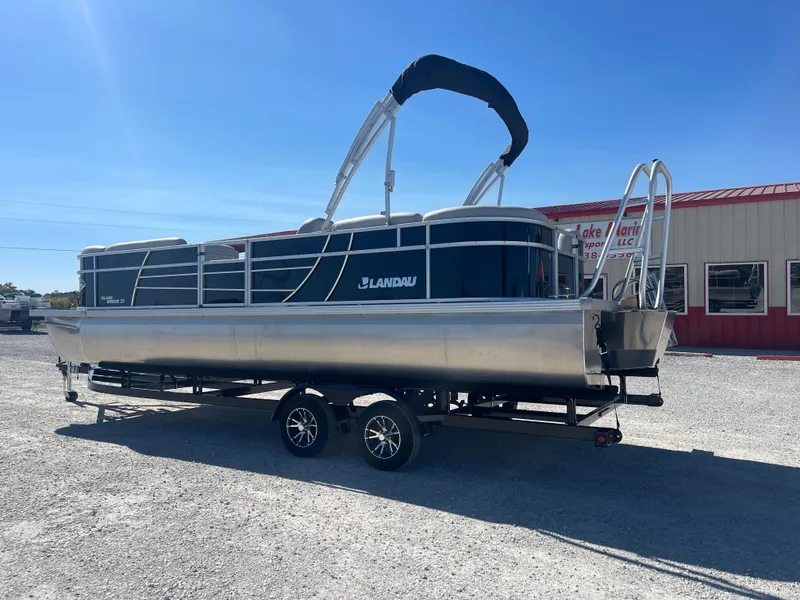 Slide: The Image of 2025 Landau Island Breeze 25 pontoon boat with 225HP Suzuki engine on trailer. - 14