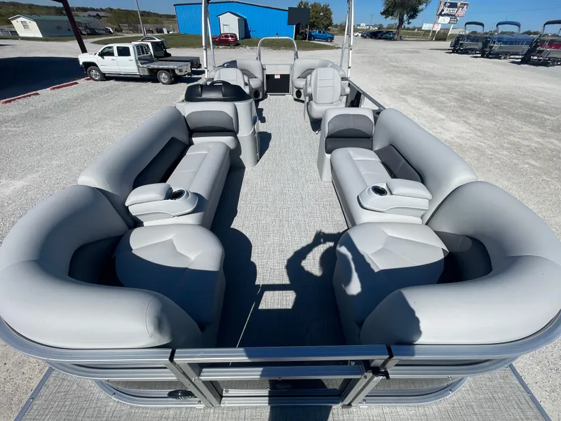 Slide: The Image of 2025 Landau Island Breeze 25 pontoon boat with spacious seating, powered by 225HP Suzuki engine. - 4