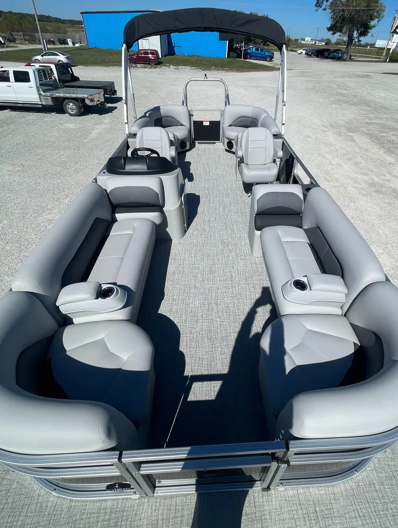 Slide: The Image of 2025 Landau Island Breeze 25 pontoon boat with spacious seating and 225HP Suzuki engine. - 5